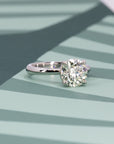 Side view of round diamond engagement ring in platinum with natural diamond, displayed on a vibrant background, crafted by Bena Jewelry in Montreal.