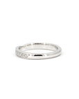 Sleek platinum wedding ring featuring a pinch detail and delicate diamonds, crafted in Montreal by Bena Jewelry, Canadian designer.