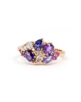 Highlights the interplay of purple and pink gemstones with the polished yellow gold band. Custom jewelry by Bena Jewelry, Montreal, Canada.