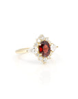 side view of pyrope garnet oval shape and lab grown diamond engagement ring custom made in montreal by bena jewelry on white background