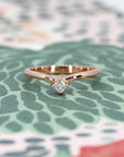 Curved rose gold ring with Asscher-cut diamond made by the indepandant designer Bena Jewelry, showcasing a bold and elegant front view.