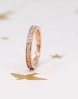 Side view of Bena Jewelry’s rose gold wedding band, featuring sparkling 1.50 mm lab-grown diamonds in a pinpoint setting. Made in Montreal, Quebec, this ring shines with elegance and is ideal for stacking.
