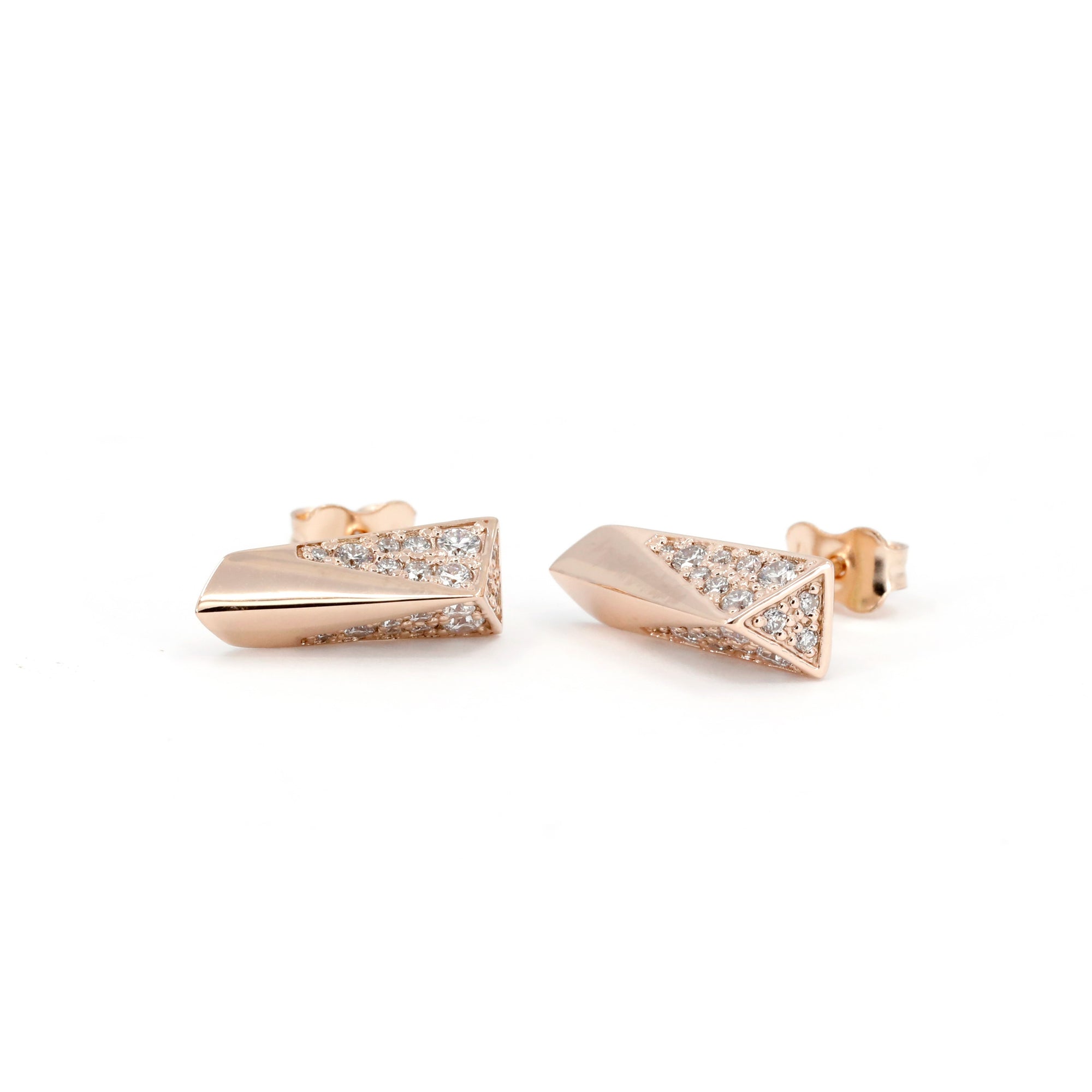 Rose Gold Pike Earrings Half Diamond showcasing its edgy design with diamond pavé on half the surface. Made by Bena Jewelry.