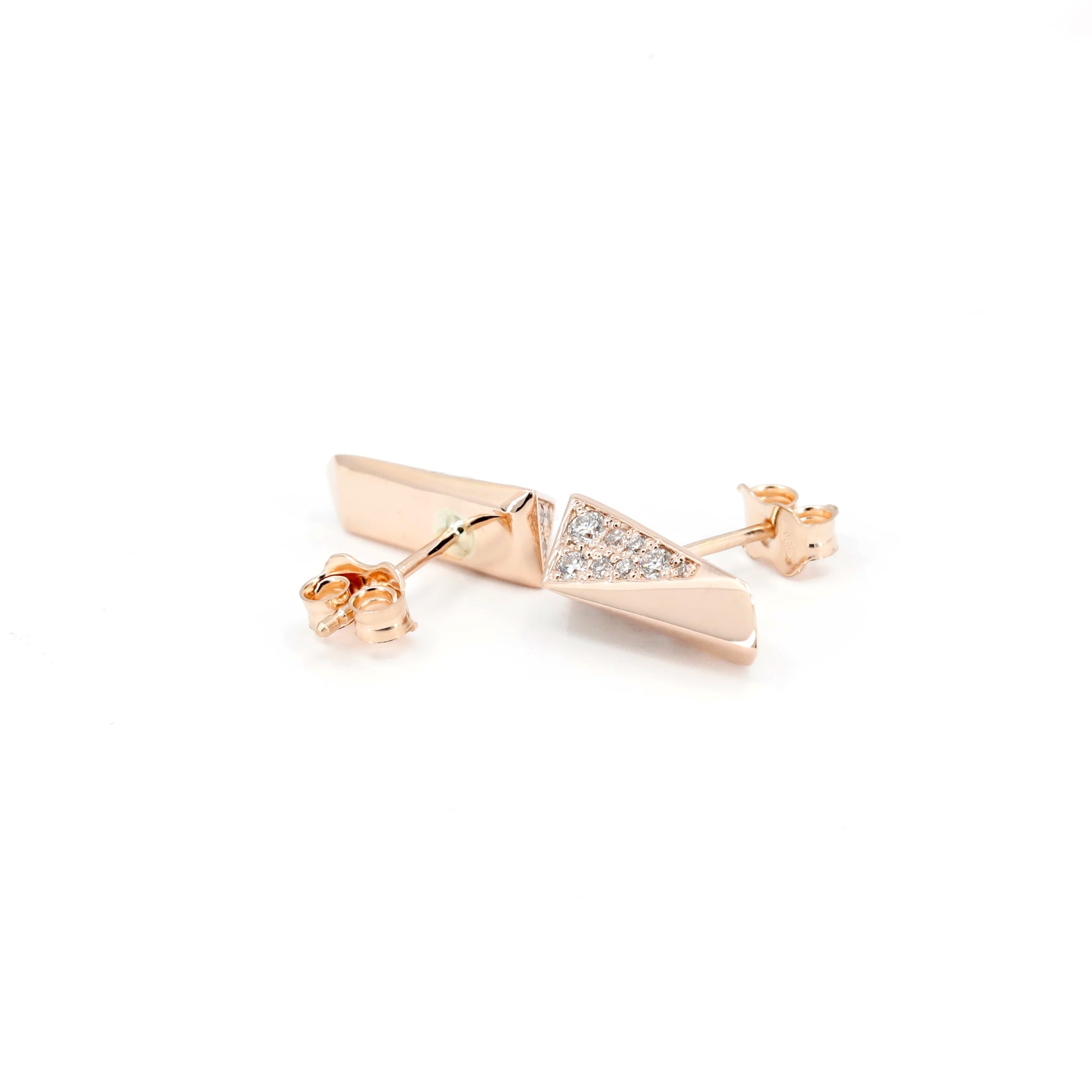 Pair of Earrings: Pair of Rose Gold Pike Earrings Half Diamond on a white surface, showcasing their edgy and luxurious design.
