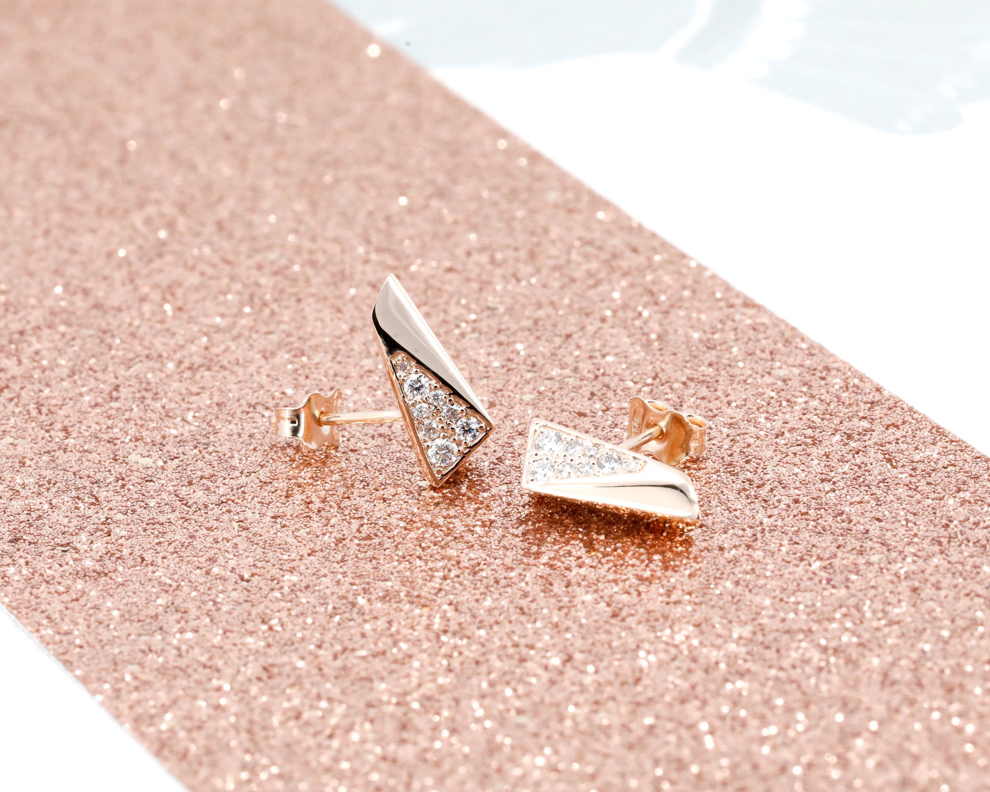 Set of Rose Gold Pike Earrings Half Diamond highlighting the sleek rose gold and partial diamond pavé. Contemporary design.