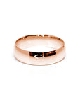 Modern rose gold domed wedding band, designed in Montreal by Bena Jewelry, featuring a high-polish finish for a sleek and contemporary wedding ring.