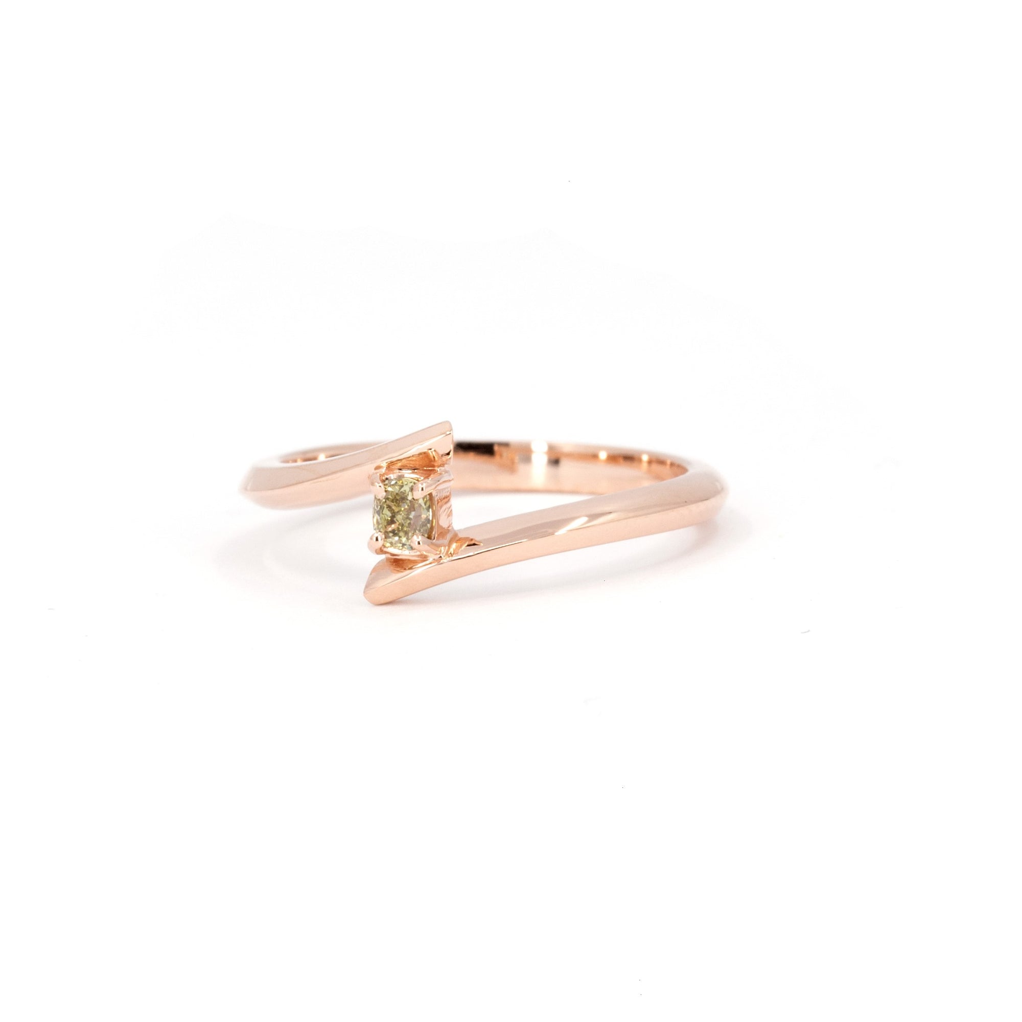 Unique minimalist ring with a yellow diamond in rose gold, designed by Bena Jewelry, photographed on a white background. Handmade in Montreal.