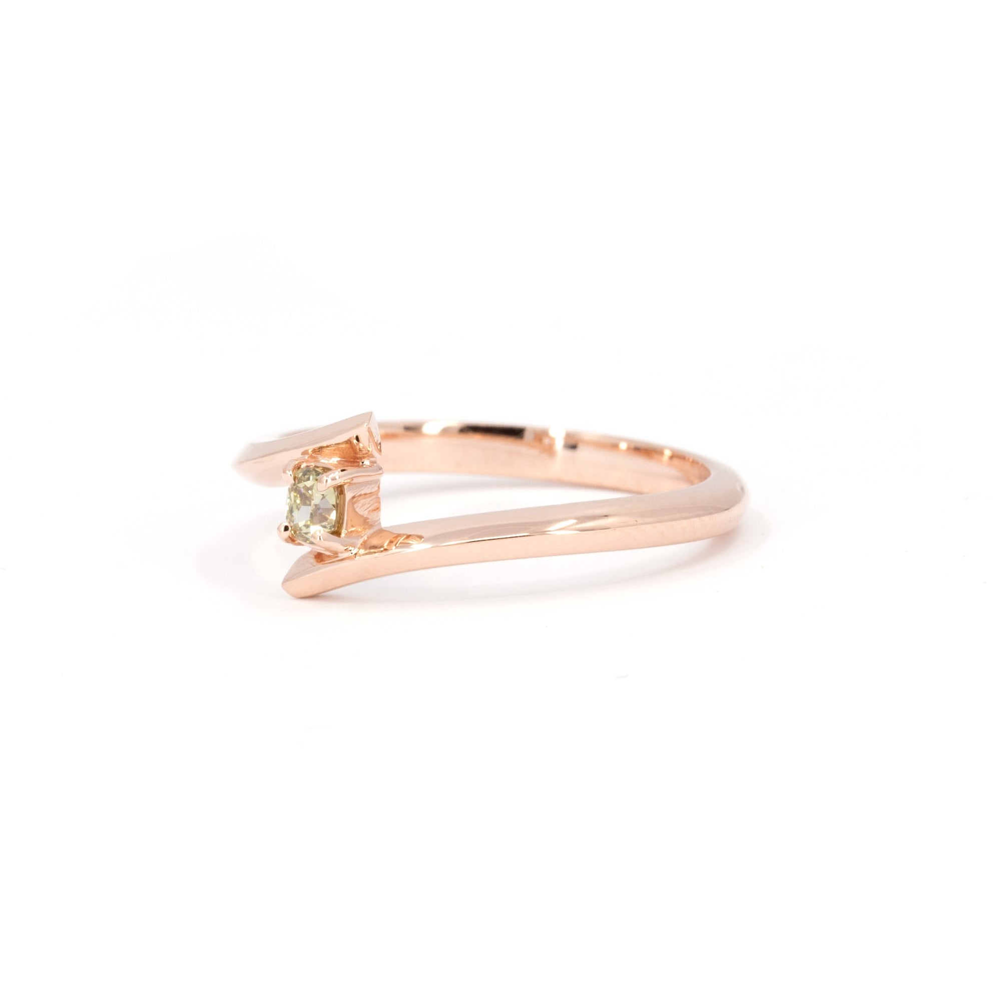 Kink Yellow Diamond Ring with a cushion-cut yellow diamond, sleek rose gold design by Bena Jewelry, displayed on a white background. Made in Canada.