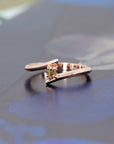 Unique Kink Yellow Diamond Ring with a cushion-cut yellow diamond, rose gold band by Bena Jewelry, showcased on a dramatic dark background. Made in Montreal.
