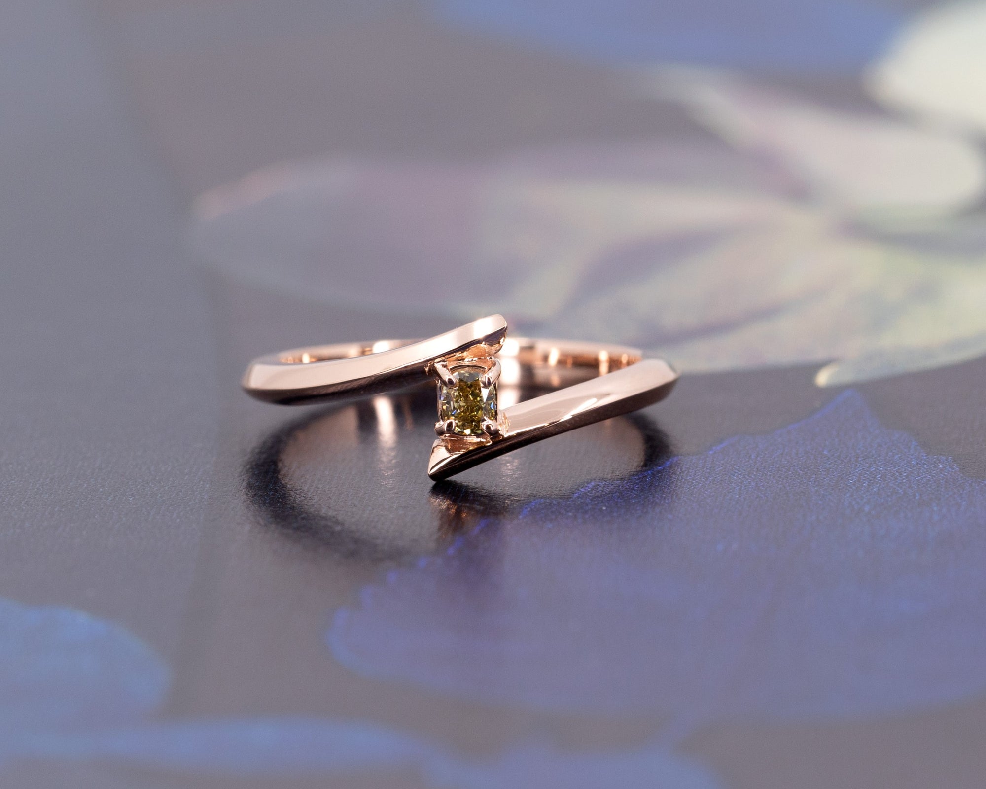 Kink Yellow Diamond Ring by Bena Jewelry, crafted in rose gold with a cushion-cut yellow diamond, photographed on a dark background. Modern and edgy design, handmade in Montreal.