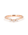 Minimalist rose gold curved band with three lab-grown diamonds, handcrafted in Montreal by Bena Jewelry. A sleek and modern wedding or stacking ring.
