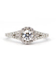 Close-up of a lab-grown diamond engagement ring in white gold. Features a round center stone, halo, and diamond accents on an open band. Custom-made by Bena Jewelry in Montreal.