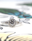 White gold engagement ring with lab-grown diamonds, styled against a bold, soft background. Unique, custom-made bridal jewelry from Bena Jewelry in Montreal.
