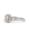 Side view of a white gold engagement ring with a lab-grown diamond halo and accent diamonds on the open band. Elegant and sustainable, crafted in Montreal by Bena Jewelry.