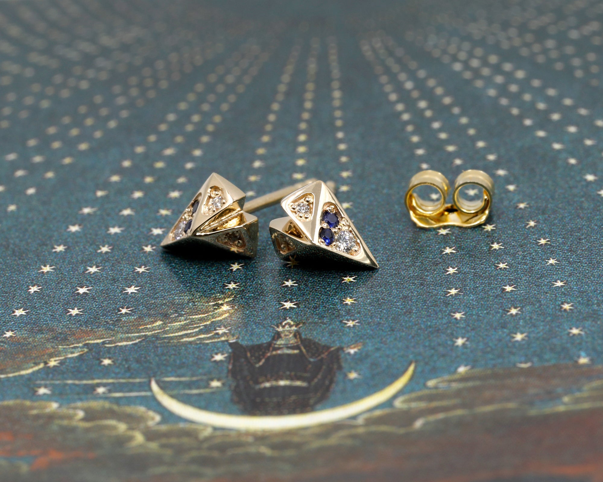 Heart-shaped sapphire and diamond stud earrings in yellow gold, styled for a statement look by Bena Jewelry.