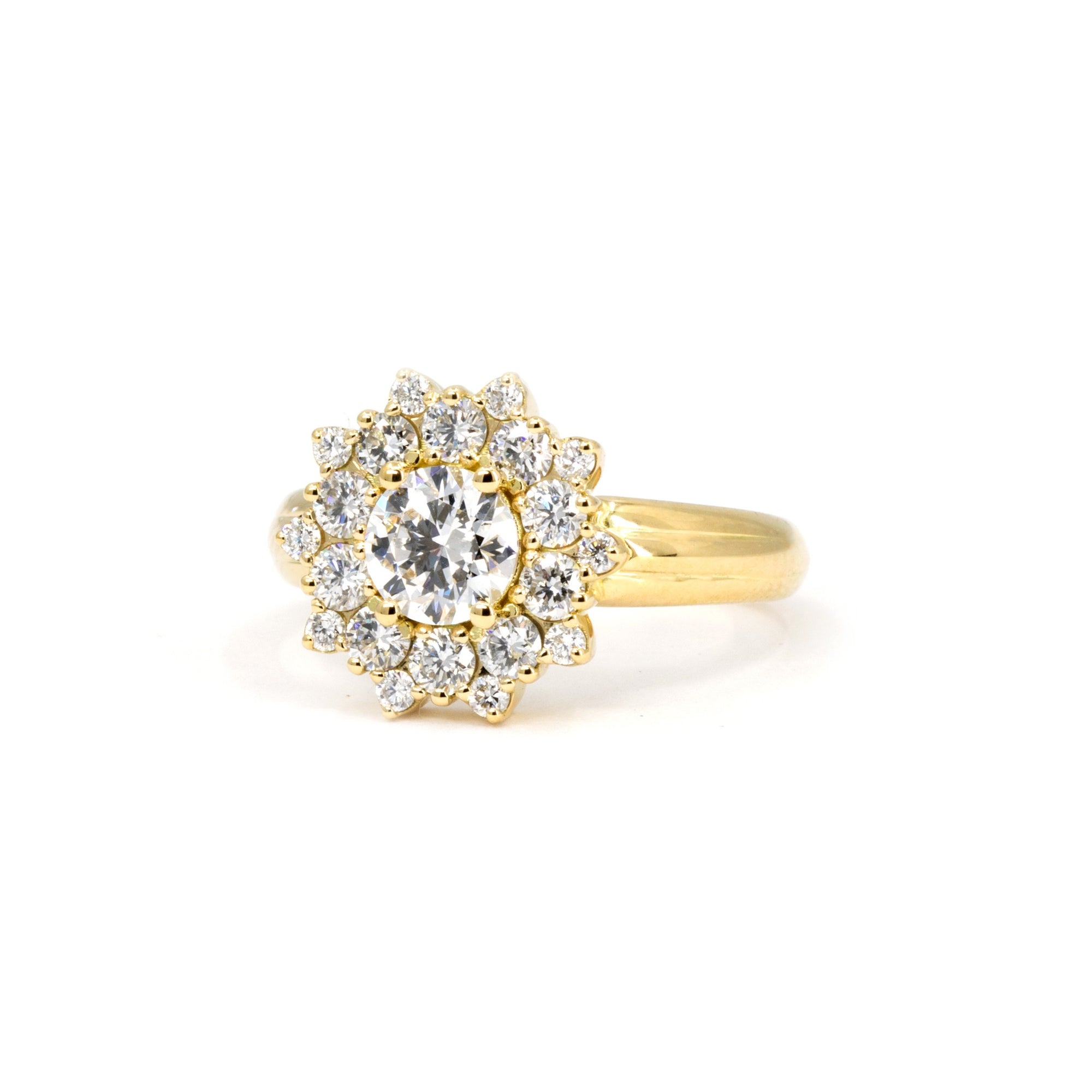 Edgy fine jewelry ring with central diamond and double halo design, by Canadian designer Bena Jewelry – white studio background