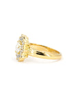 Side view of yellow gold engagement ring with floral diamond halo, crafted by Bena Jewelry in Montreal – white backdrop
