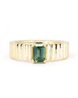 Teal Sapphire Emerald-Cut Gold Ring, handcrafted by Bena Jewelry in Montreal – A bold unisex ring featuring a deep green sapphire in an emerald cut, set on a structured yellow gold band.