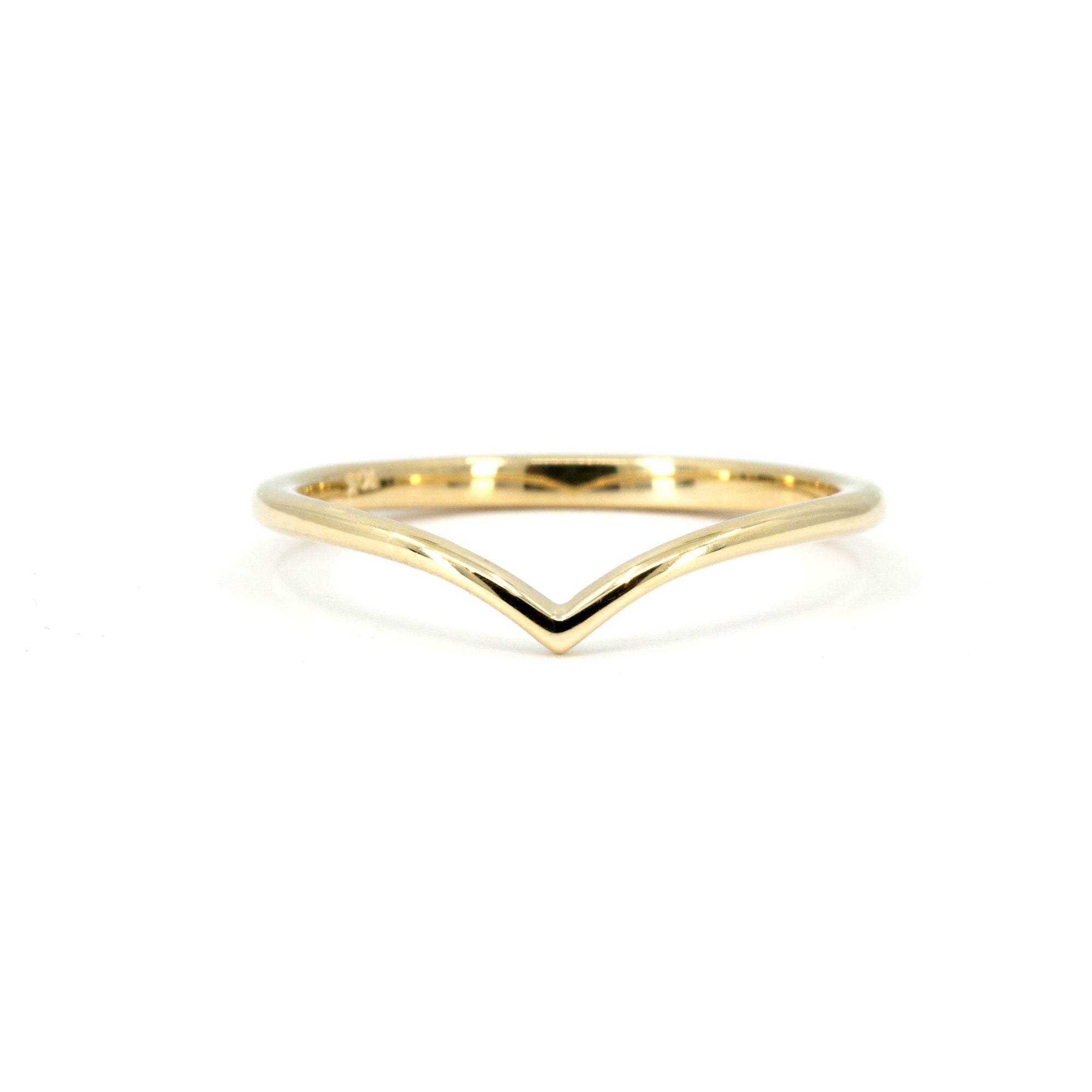 V-shaped yellow gold wedding band by Bena Jewelry, minimalist and modern, displayed on a white background.