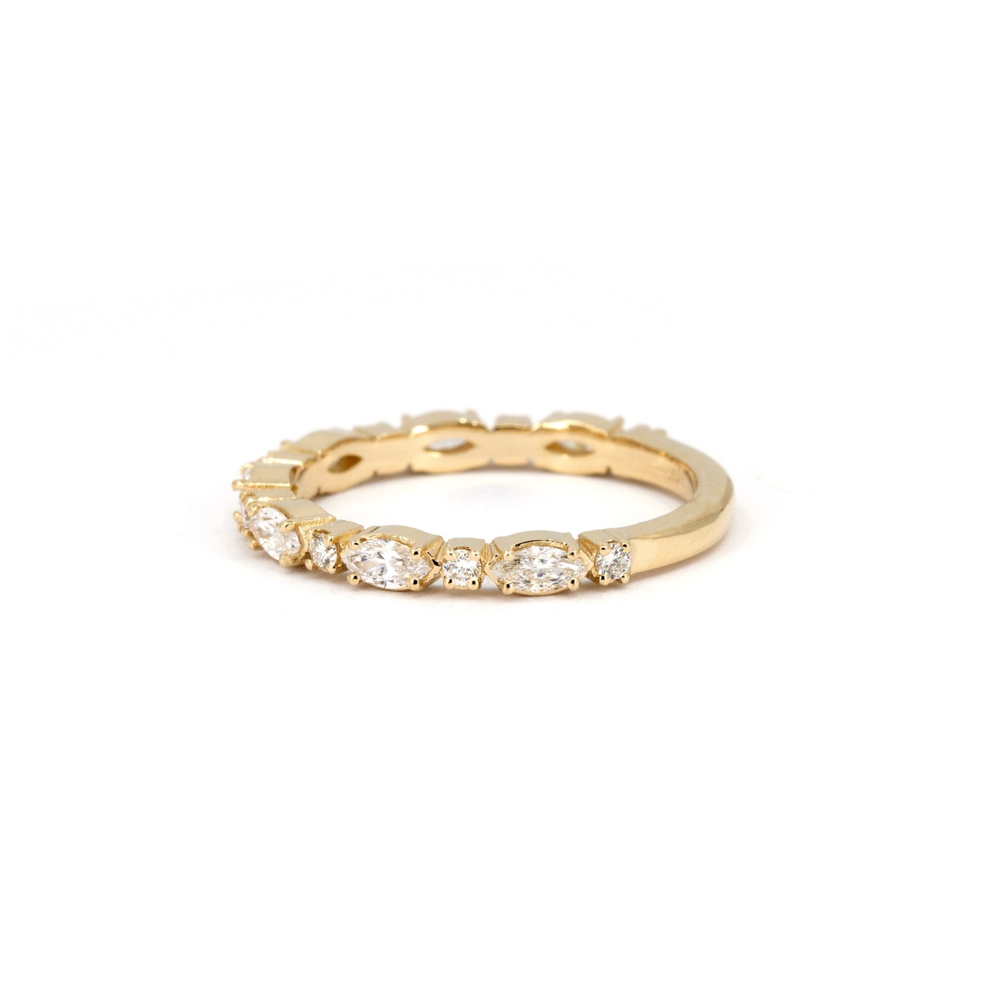 Custom-made marquise diamond wedding band in yellow gold, a sophisticated bridal ring handcrafted in Montreal.