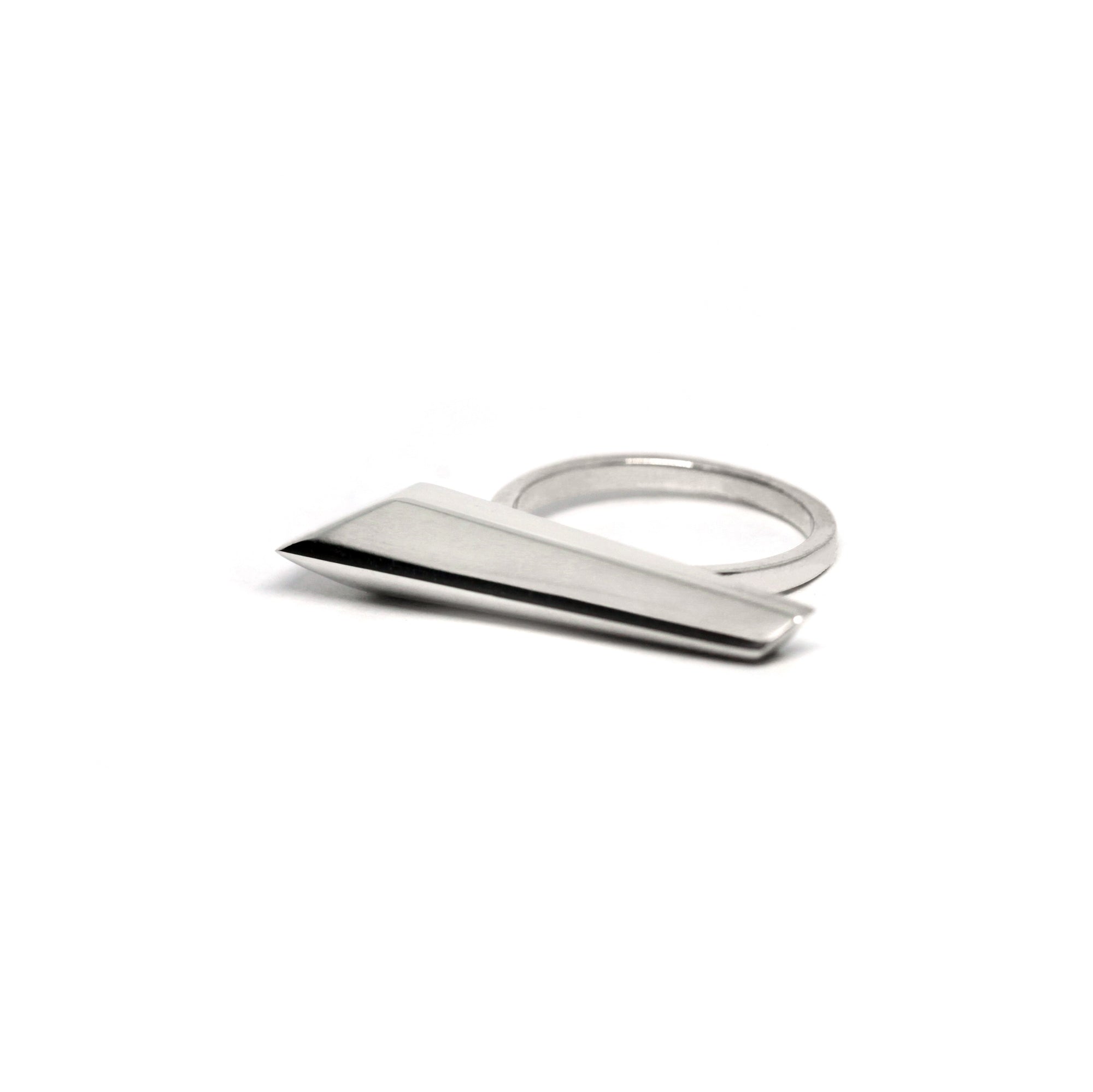 Close-up of Allure Ring in White Gold – A sleek and edgy designer ring with geometric lines and a bold, sculptural design.