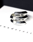 Front view of Embrace Ring in White Gold – A striking unisex ring with an open, sculptural design, blending modernity and elegance.