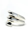 Close-up of Embrace Ring in White Gold – A unique statement ring with a strong geometric structure and high-polish finish.