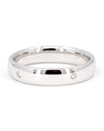 White gold wedding band with bezel-set diamonds by Bena Jewelry photographed on a clean white background custom-made bridal ring in Montreal