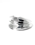 Side view of Crush Ring in White Gold – A contemporary unisex jewelry piece with an avant-garde, high-polish structure.
