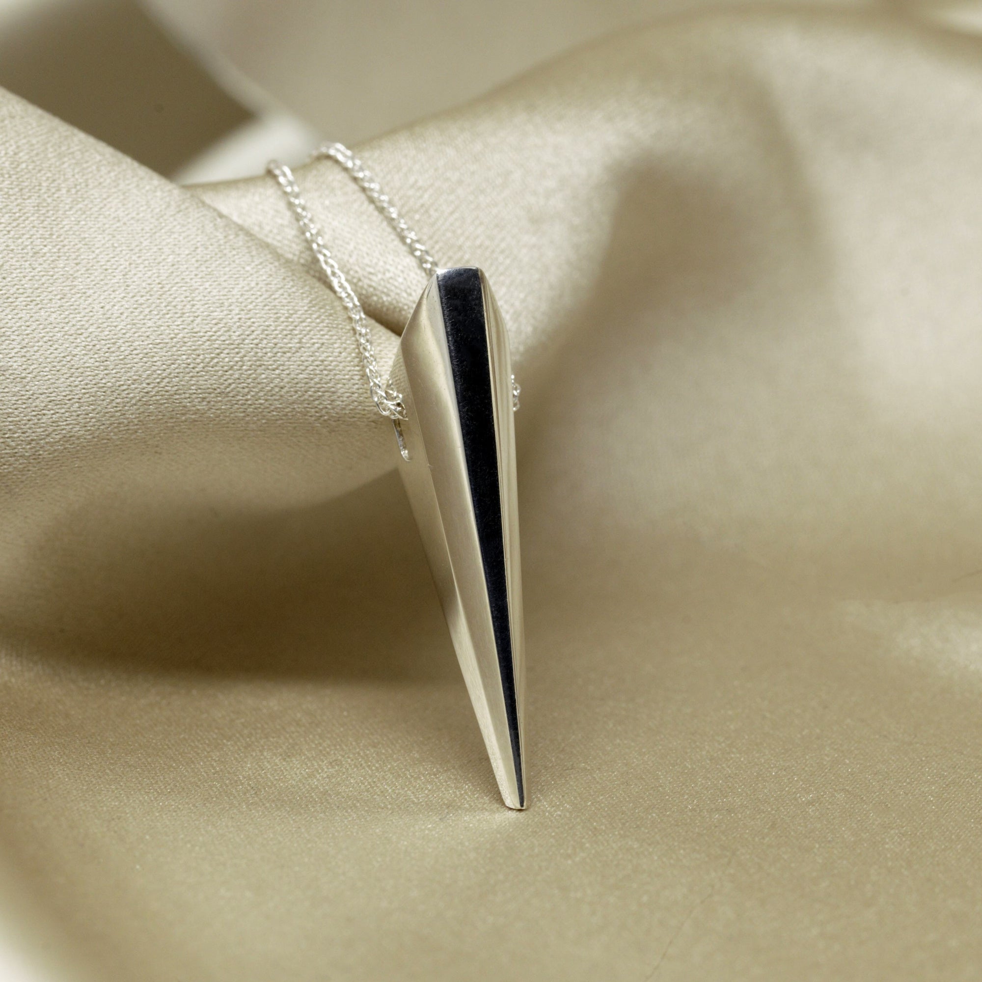 Minimalist White Gold Pendant by Bena Jewelry, Montreal’s fine jewelry designer – A bold, refined pendant that blends sleek aesthetics with a powerful statement.