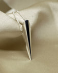 Minimalist White Gold Pendant by Bena Jewelry, Montreal’s fine jewelry designer – A bold, refined pendant that blends sleek aesthetics with a powerful statement.
