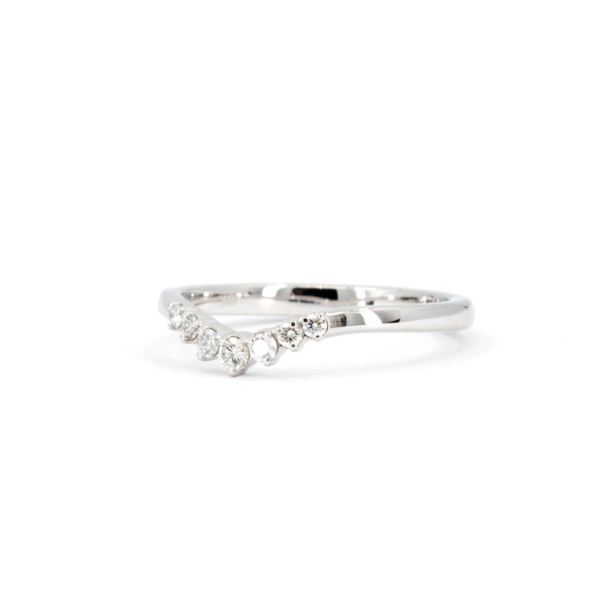 Delicate diamond wedding band in white gold, crafted by Canadian designer Bena Jewelry in Montreal, perfect for pairing with engagement rings.