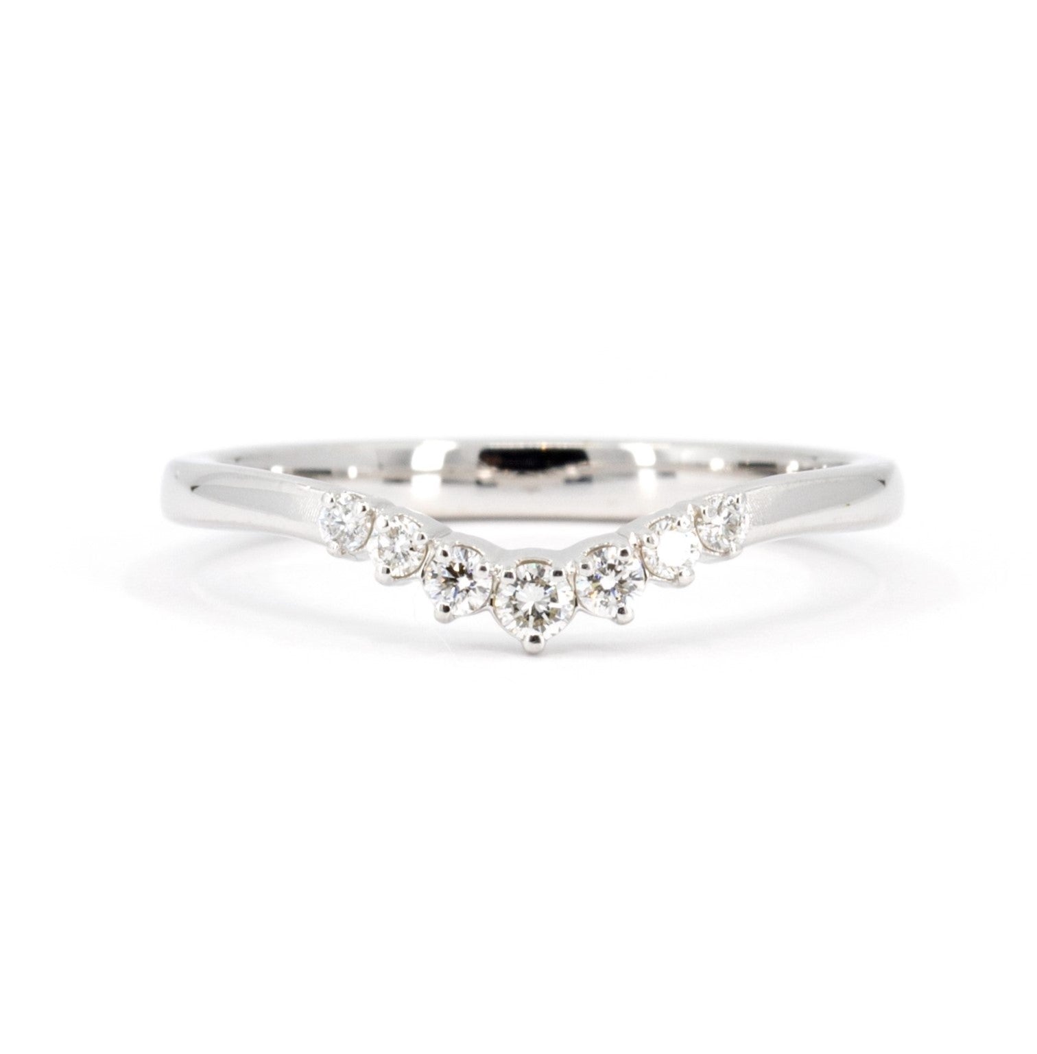 White gold diamond wedding band featuring a delicate row of natural diamonds, crafted by Bena Jewelry in Montreal, Canada, designed to pair with engagement rings.