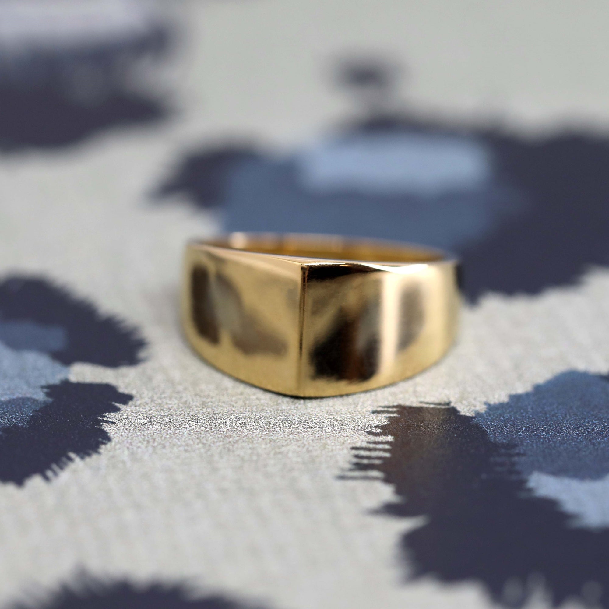 Top-down view of Lump Ring in Yellow Gold – A refined designer ring featuring a soft, curved silhouette.