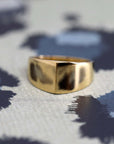 Top-down view of Lump Ring in Yellow Gold – A refined designer ring featuring a soft, curved silhouette.