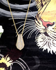 Artistic view of the Ballast pendant by Bena Jewelry, featuring intricate architectural design and diamond pavé. A modern, edgy statement piece crafted for those who embrace audacious jewelry.