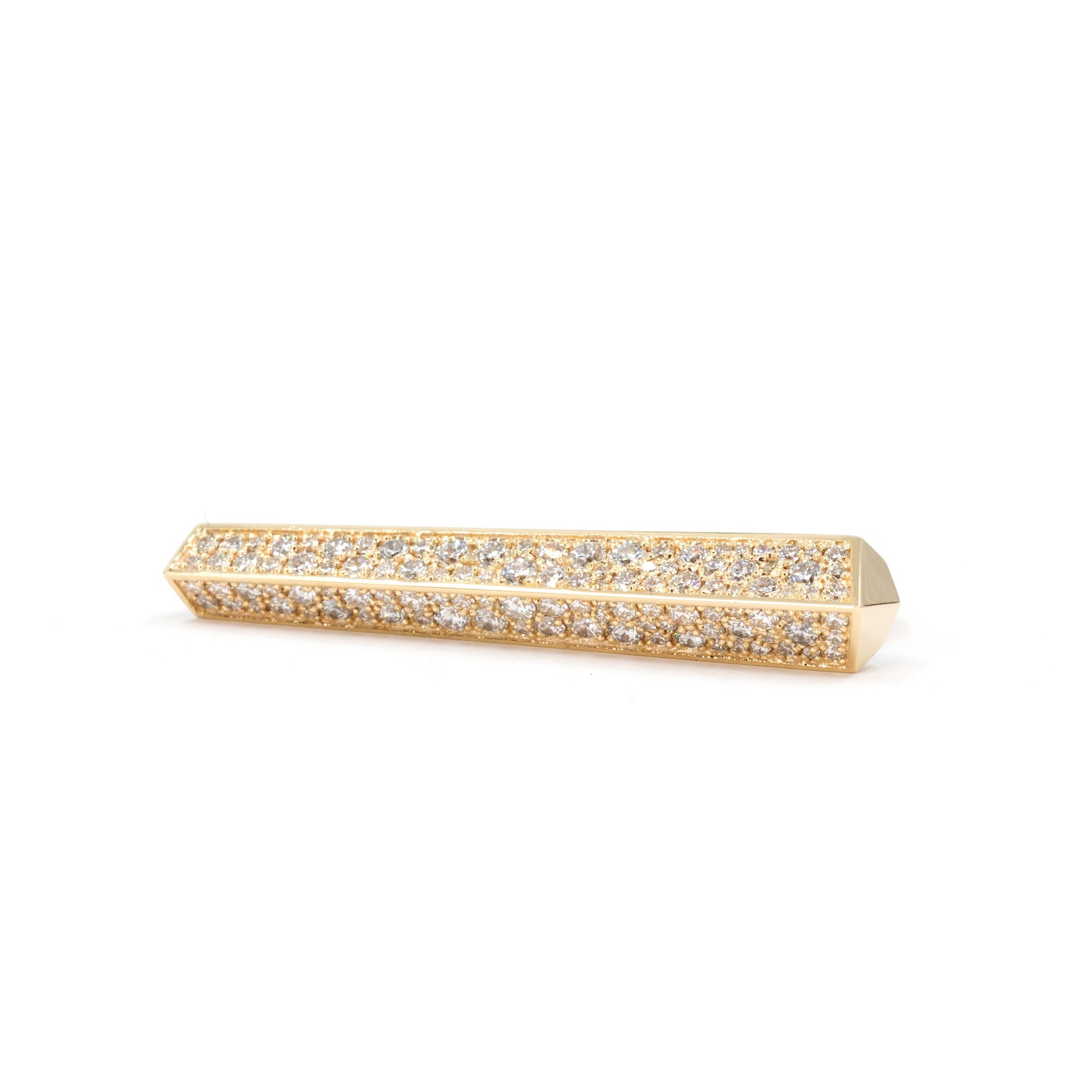Long yellow gold ring with double band designed to be worn on two fingers. It is a large piece of yellow gold set with several round brilliant diamonds. It looks like a contemporary work of art. It's a modern, geometric ring that reflects light in all directions when worn. Created by independent designer Bena Jewelry, based in Montreal, Canada. We see the ring on a white background, almost from its face.