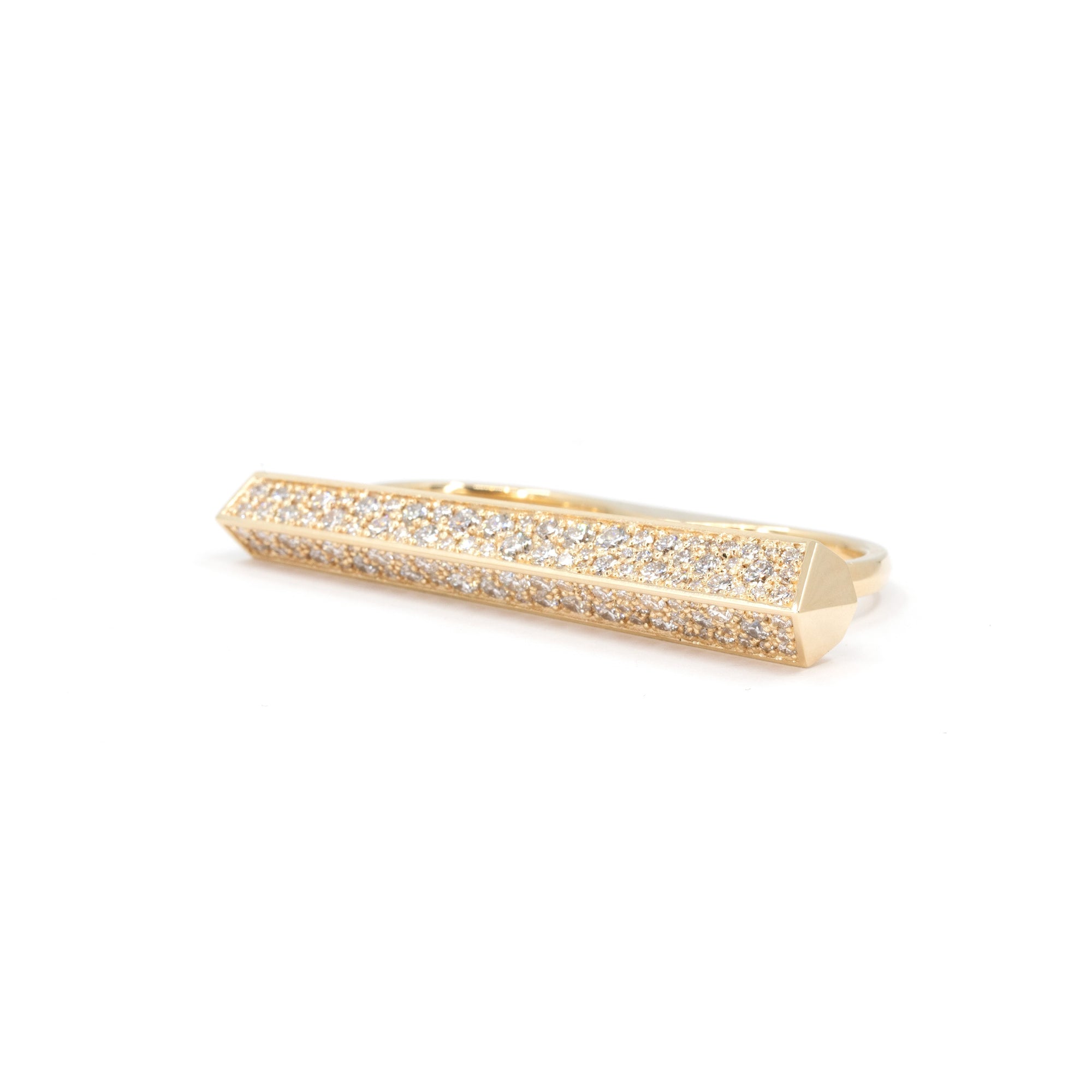 Long yellow gold ring with double band designed to be worn on two fingers. It is a large piece of yellow gold set with several round brilliant diamonds. It looks like a contemporary work of art. It's a modern, geometric ring that reflects light in all directions when worn. Created by independent designer Bena Jewelry, based in Montreal, Canada.