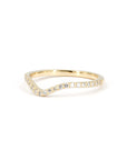 Classic yellow gold curved wedding band featuring diamonds, made to complement an engagement ring. Custom-made by Bena Jewelry in Montreal.
