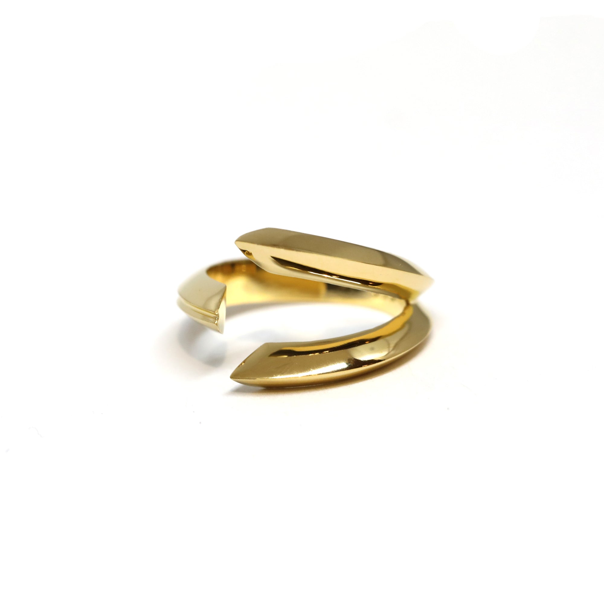 Fang Ring in Yellow Gold on white background – A bold and sculptural unisex gold ring with a fang-inspired open design, handcrafted by Bena Jewelry in Montreal.