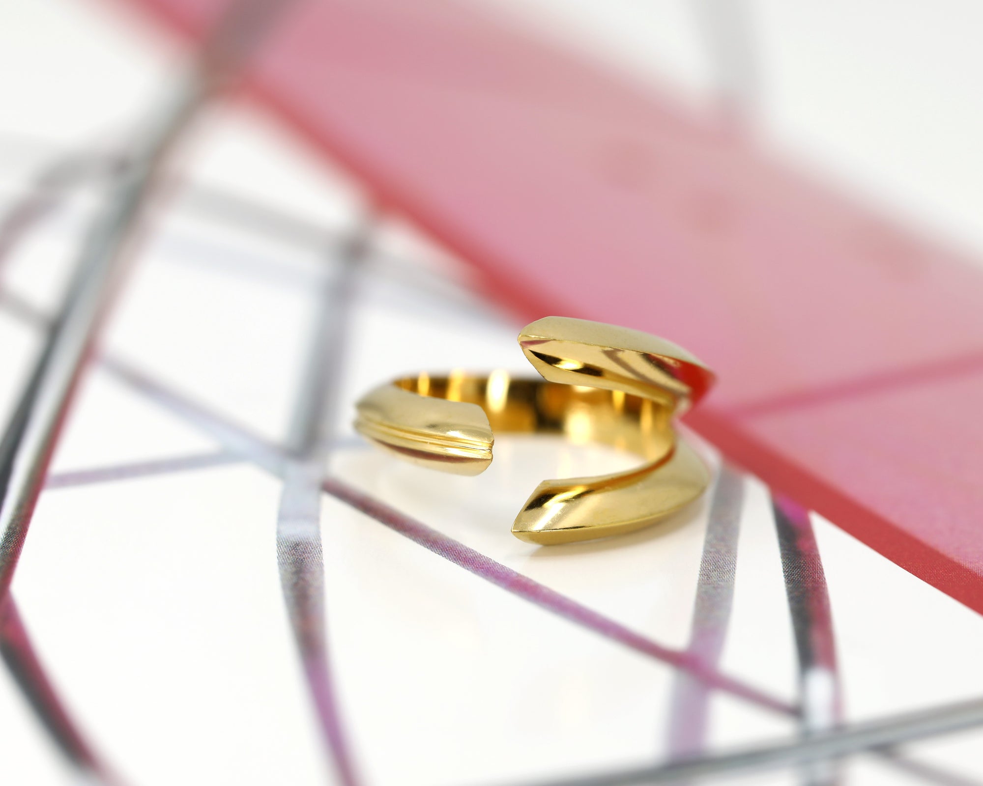 Close-up of Fang Ring in Yellow Gold – A statement designer ring with a strong, sharp-edged silhouette and high-polish finish.
