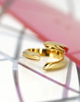 Close-up of Fang Ring in Yellow Gold – A statement designer ring with a strong, sharp-edged silhouette and high-polish finish.