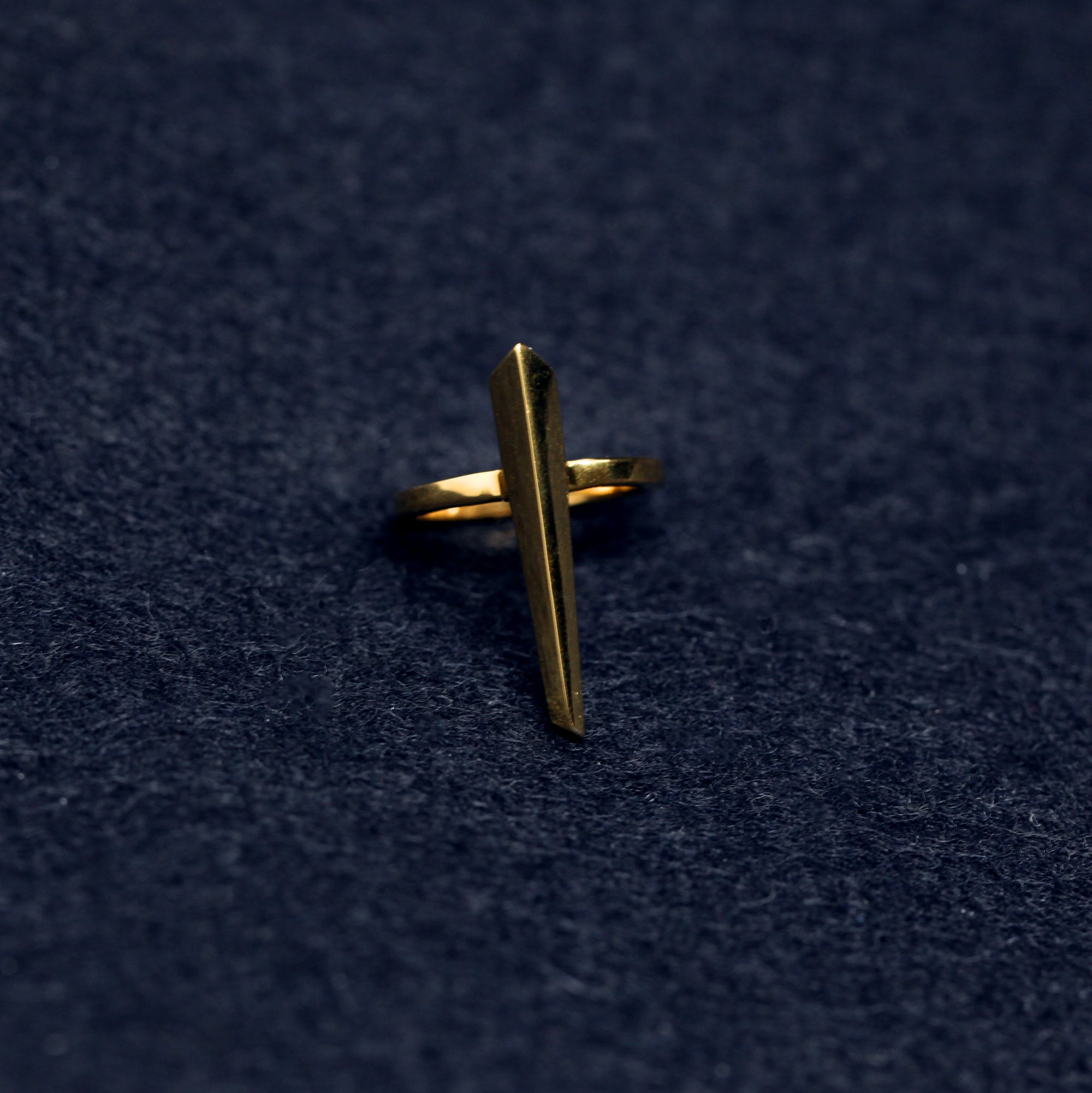 Top-down view of Peak Ring in Yellow Gold – A contemporary and daring gold ring with sharp geometric lines.