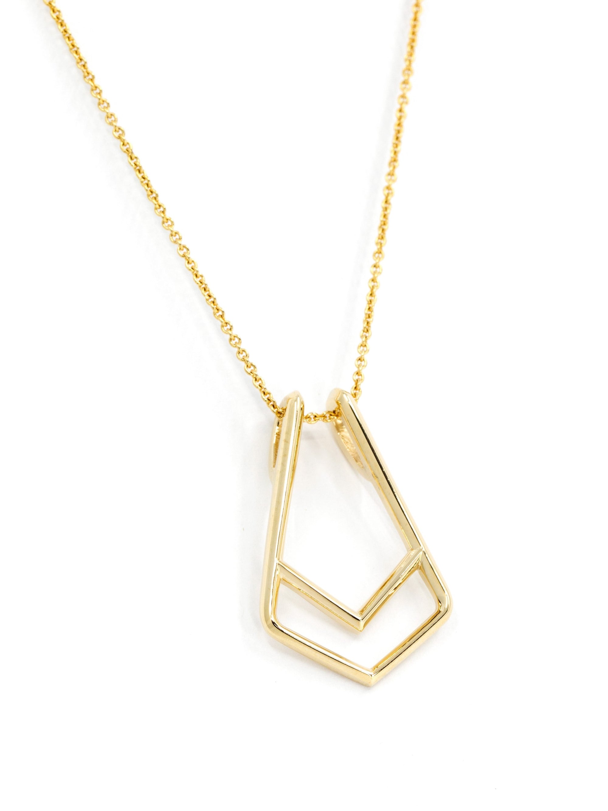 Innovative jewelry design: a ring holder pendant in solid gold – This minimalist pendant transforms a ring into a statement piece, offering both practicality and elegance.
