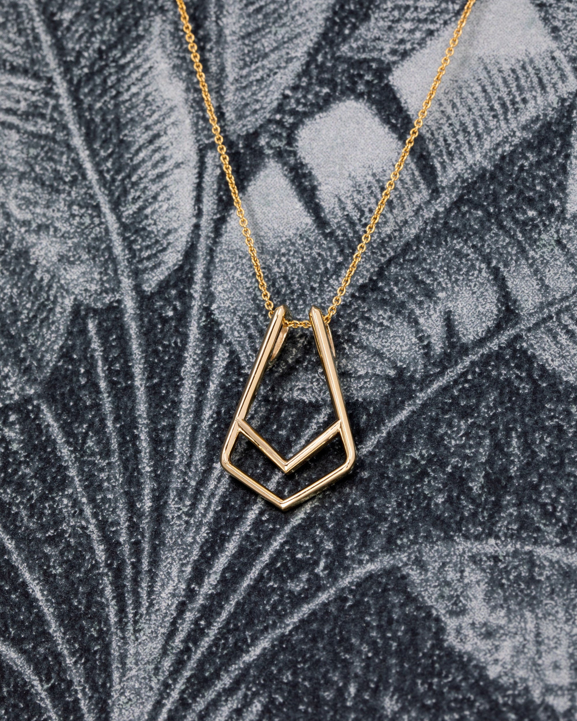 Versatile yellow gold ring holder pendant for modern jewelry lovers – A stylish and functional pendant that allows you to wear your ring as a necklace, crafted by Bena Jewelry in Montreal.