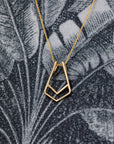 Versatile yellow gold ring holder pendant for modern jewelry lovers – A stylish and functional pendant that allows you to wear your ring as a necklace, crafted by Bena Jewelry in Montreal.