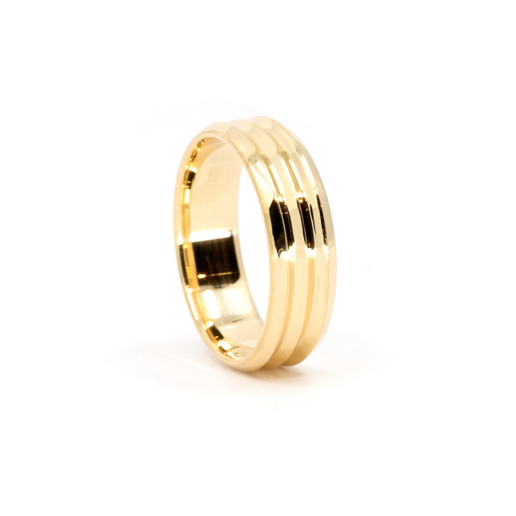 Trois Vagues yellow gold men's wedding band, featuring three sleek central lines, by Bena Jewelry, displayed on a clean white background.