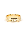 Close-up of the Trois Vagues by Bena Jewelry yellow gold wedding band for men, showcasing the three elegant lines in the center.
