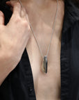 Womant wearing statement sterling silver pendant