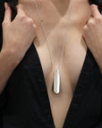 Girl wearing statement sterling silver pendant